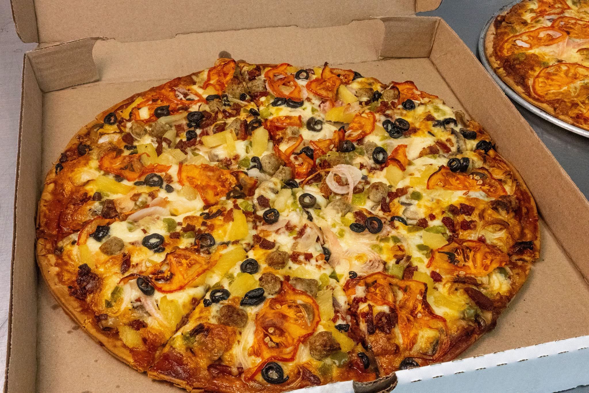 Loaded Salty’s pizza with cheese, vegetables and toppings
